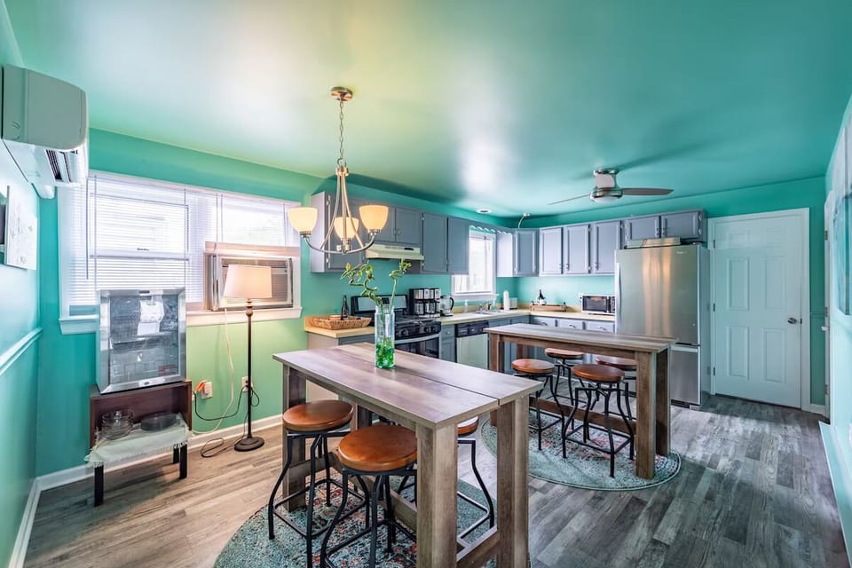 Cook together in a bright, beachy kitchen with bar seating.