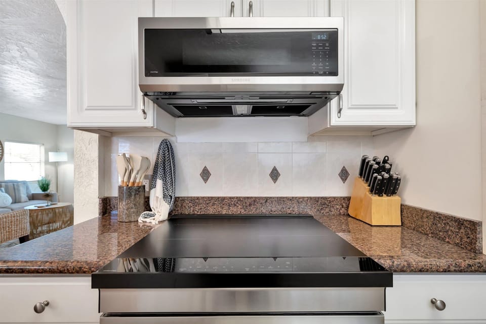 Whip up culinary magic in our cozy kitchen with a microwave that makes mealtime a breeze! 