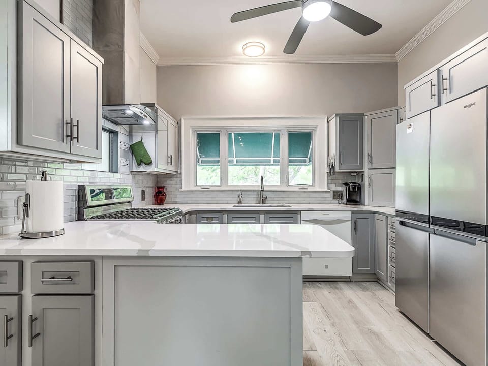 Cook up a storm in our fully-equipped, modern kitchen. With new stainless steel appliances, a spacious island, and plenty of counter space, you'll have everything you need for a comfortable stay.