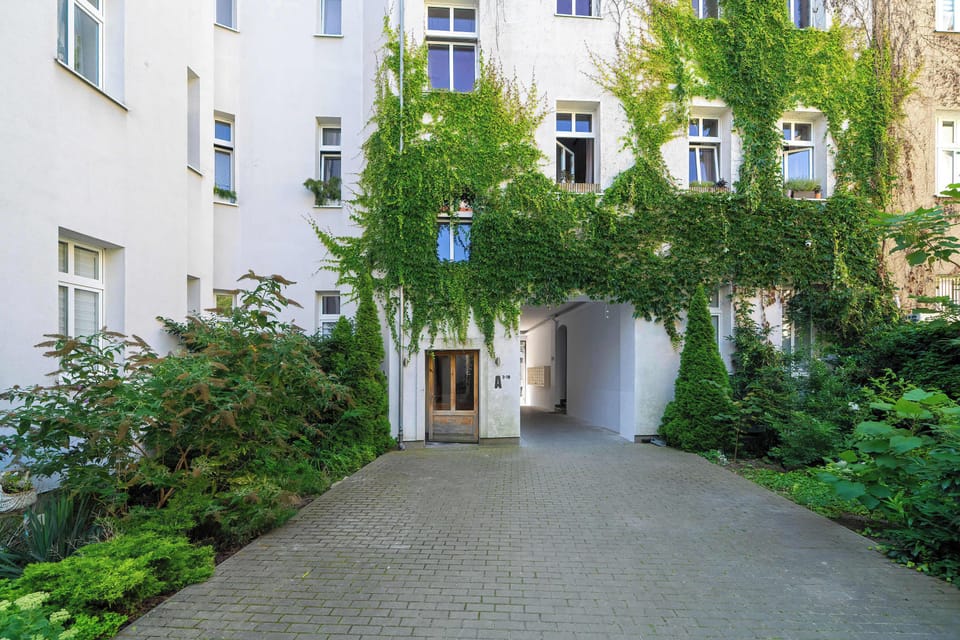 A charming courtyard surrounded by greenery. It provides a quiet escape from the city streets.