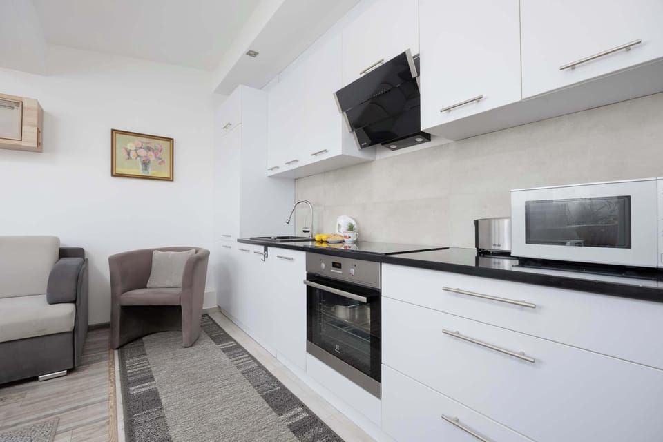 The kitchenette's practical layout maximizes space and functionality.