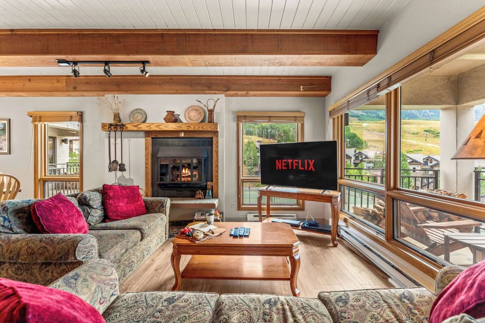 【Living Room + Fireplace】Wood-burning fireplace and a sectional built for the whole group