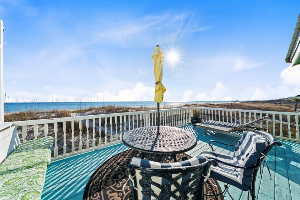 Your private beachfront deck offers stunning ocean views with comfortable seating for morning coffee or sunset cocktails.