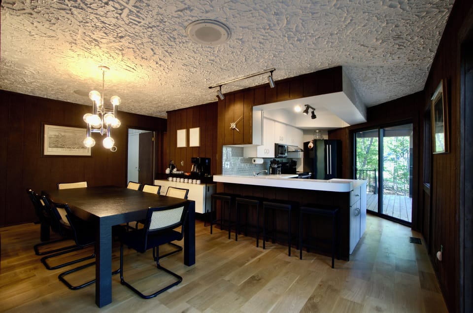 Kitchen and dining area with modern island seating
