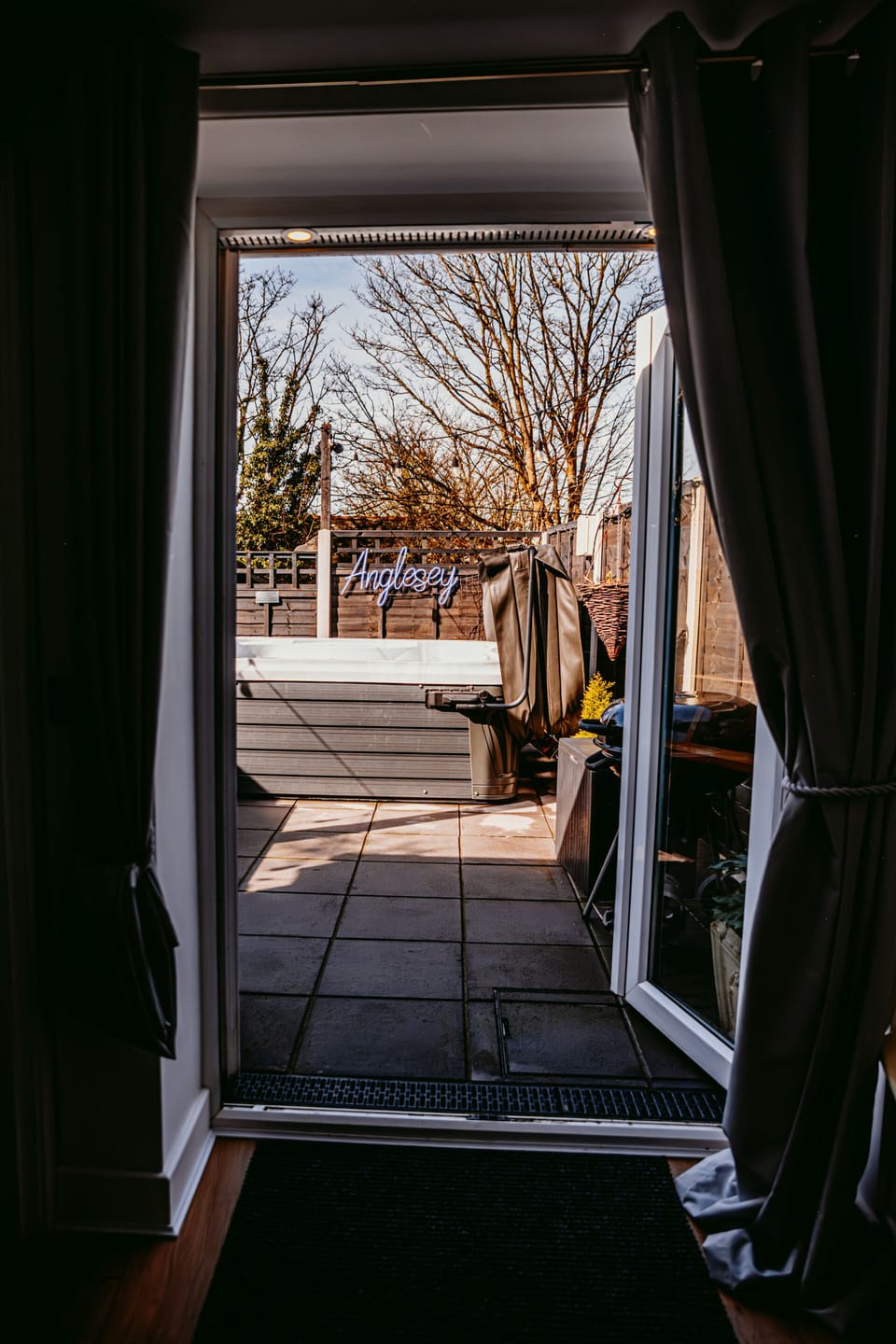 view of hot tub front back door 