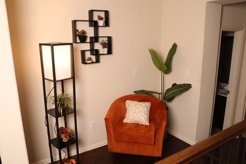 Cozy reading nook with a comfortable chair and stylish decor, creating a perfect corner for relaxation or enjoying a quiet moment after exploring Historic Downtown Wylie.