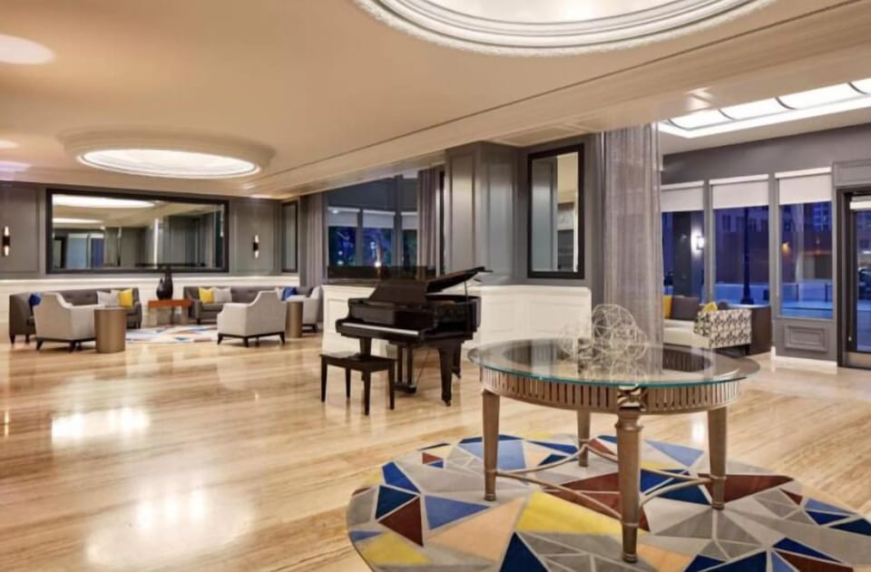 Relax at night with elegant seating and a classic grand piano.