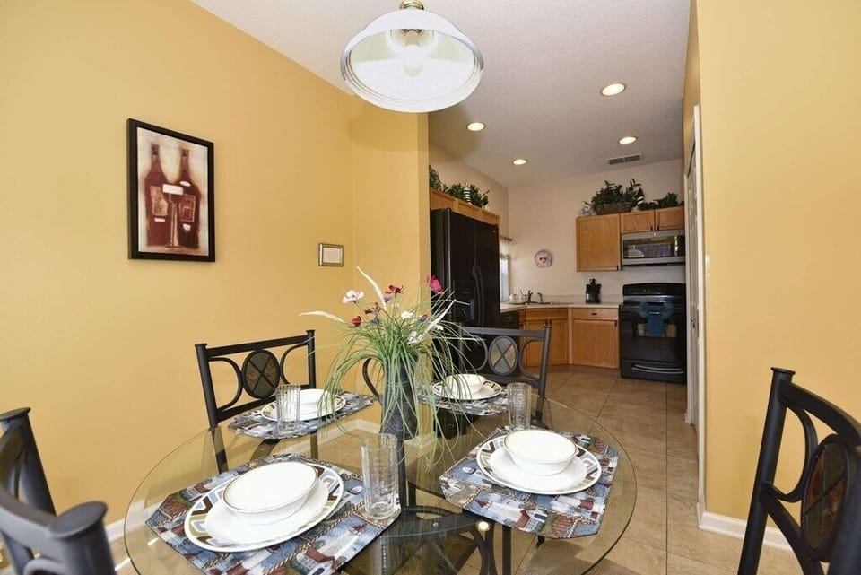 Elegant dining area with a view into the open kitchen space.