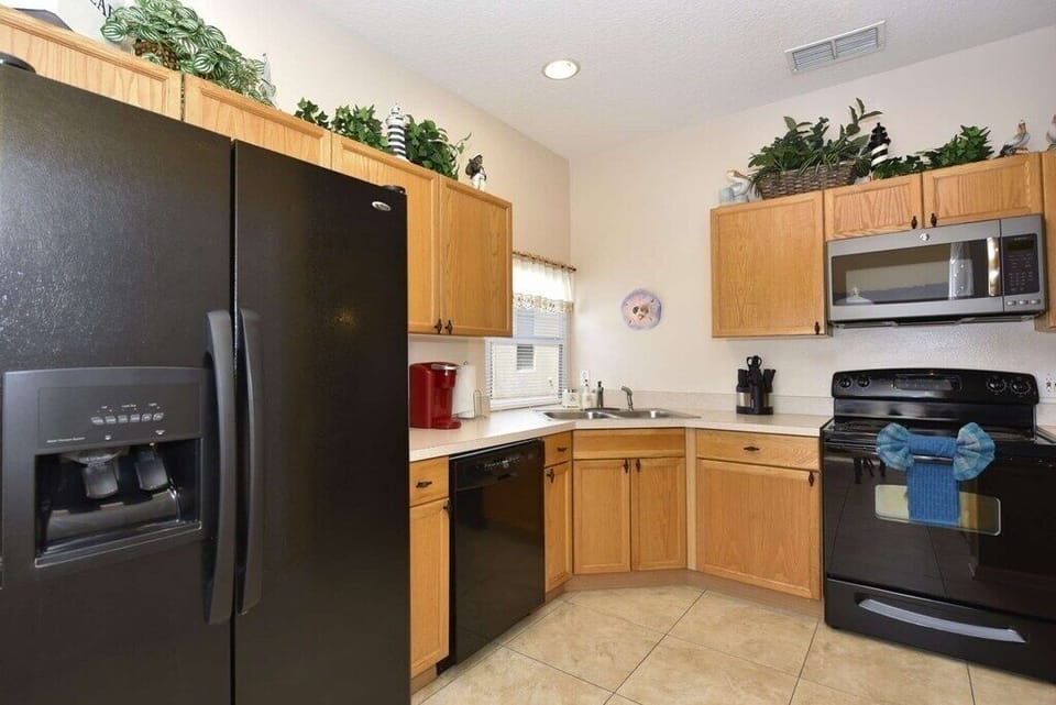 Fully equipped kitchen with modern appliances and ample counter space.