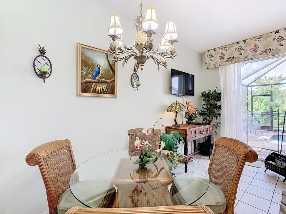 Elegant dining area with a chandelier and seating for intimate meals.