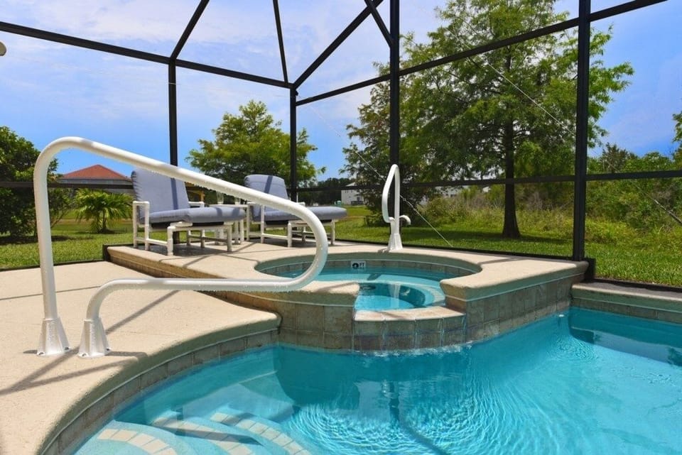 Relax in your private spa with serene views of the surrounding greenery.