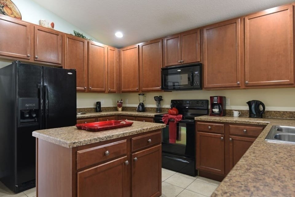 Fully equipped kitchen with modern appliances and ample counter space.
