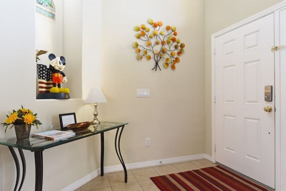 Welcoming foyer with cheerful decor and a convenient desk area.