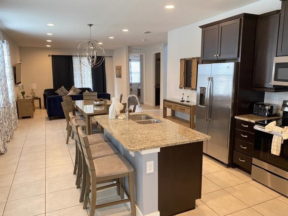 Spacious gourmet kitchen with island seating and elegant finishes.