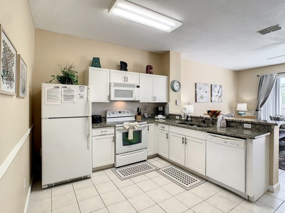 Fully equipped kitchen with ample space and modern conveniences for home-cooked meals.
