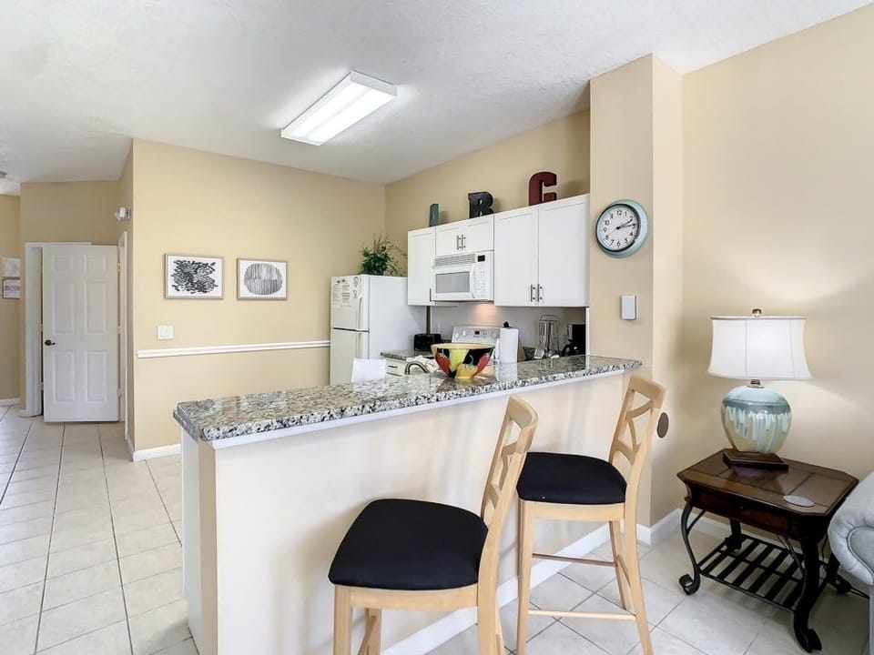 Breakfast bar with comfortable seating, perfect for casual dining or morning coffee.
