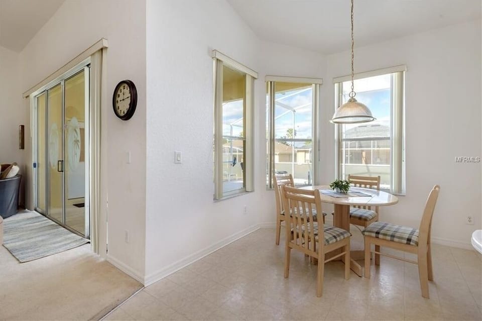 Breakfast nook with poolside views, perfect for casual meals.