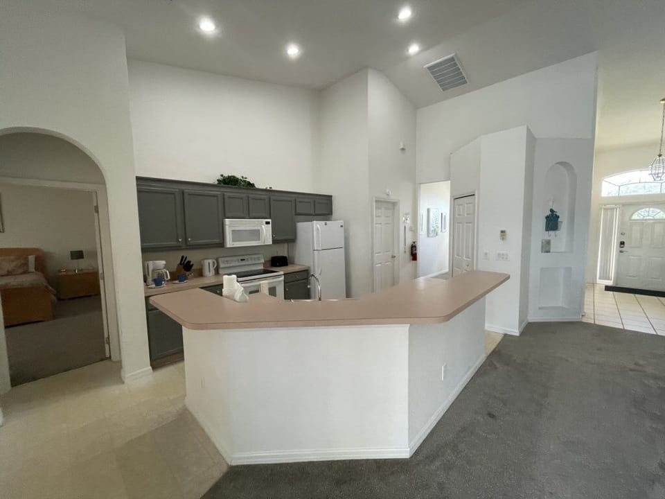 Fully equipped kitchen with ample counter space for preparing family meals.