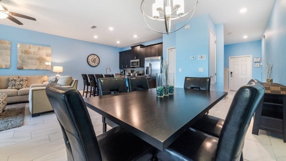 Open-concept dining and kitchen space with modern finishes and sleek design.