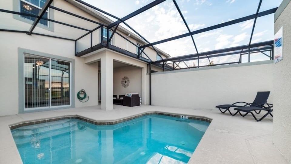 Private screened-in pool offering a refreshing escape under the sun.