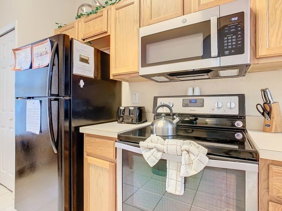 Modern kitchen appliances including a microwave and sleek stovetop for convenient cooking.