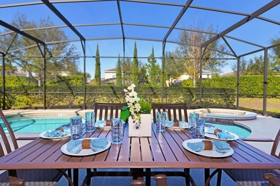 Enjoy outdoor dining with a view! Set your table by the poolside for a perfect meal in the fresh air.