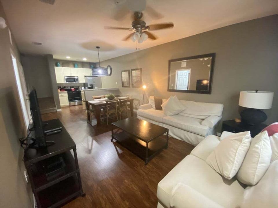 Bright and cozy living area with comfortable seating and modern decor.