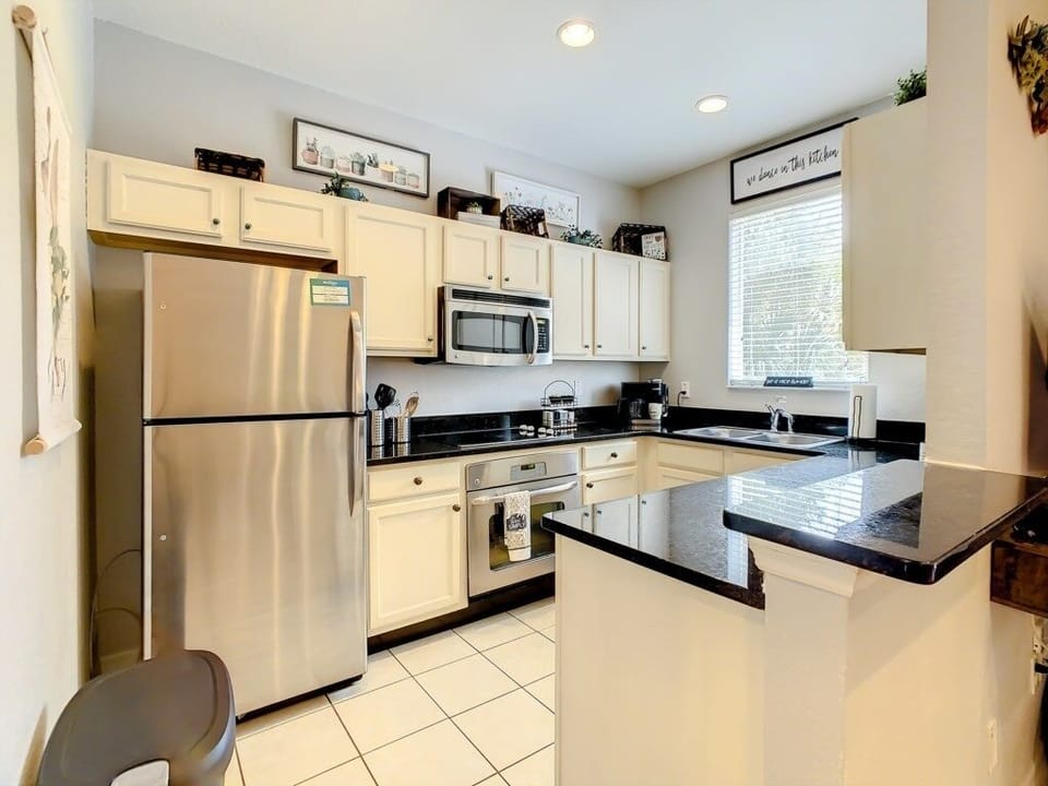 Bright, spacious kitchen with ample counter space for family meals.