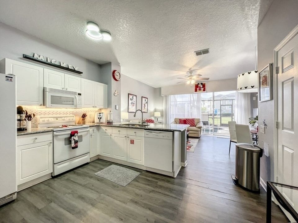 Fully equipped modern kitchen with ample counter space and Disney accents.