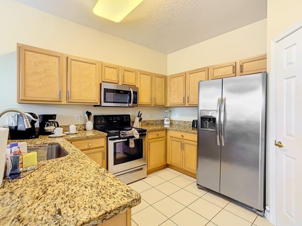 Fully equipped kitchen with modern appliances and ample counter space.