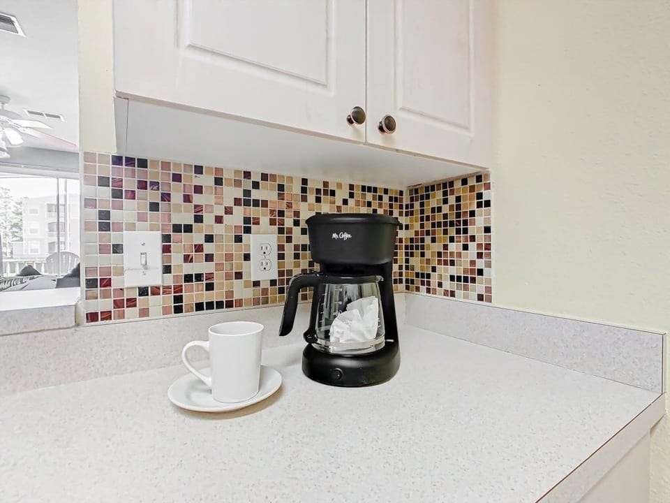 Coffee corner for your morning brew, complete with a cozy and functional setup.