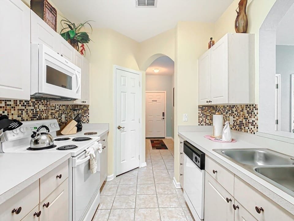 Fully equipped kitchen with modern appliances, ready for your culinary creations.