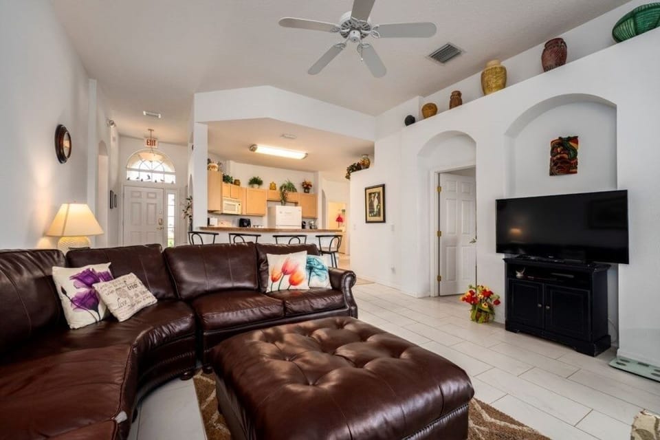 LIVING ROOM:  1 Sectional Sofa with Seating for 6, 1 Loveseat and 1 Chair