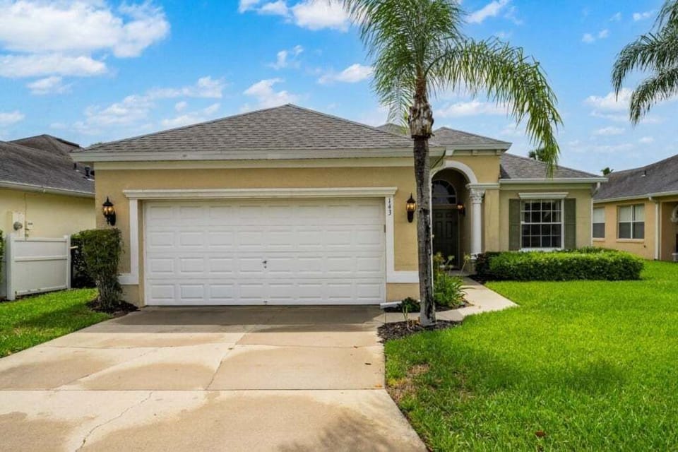 FRONT EXTERIOR:  4 Bedroom, 3 Bath Home with Driveway for 2 Vehicles