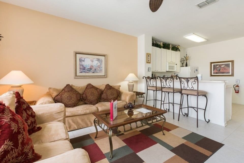 Spacious living area with plush sofas and a cozy ambiance for relaxation.