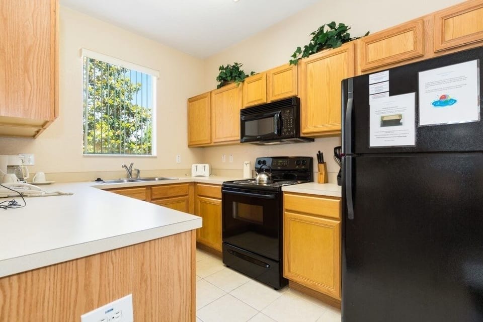Fully equipped kitchen with modern appliances for home-cooked meals.