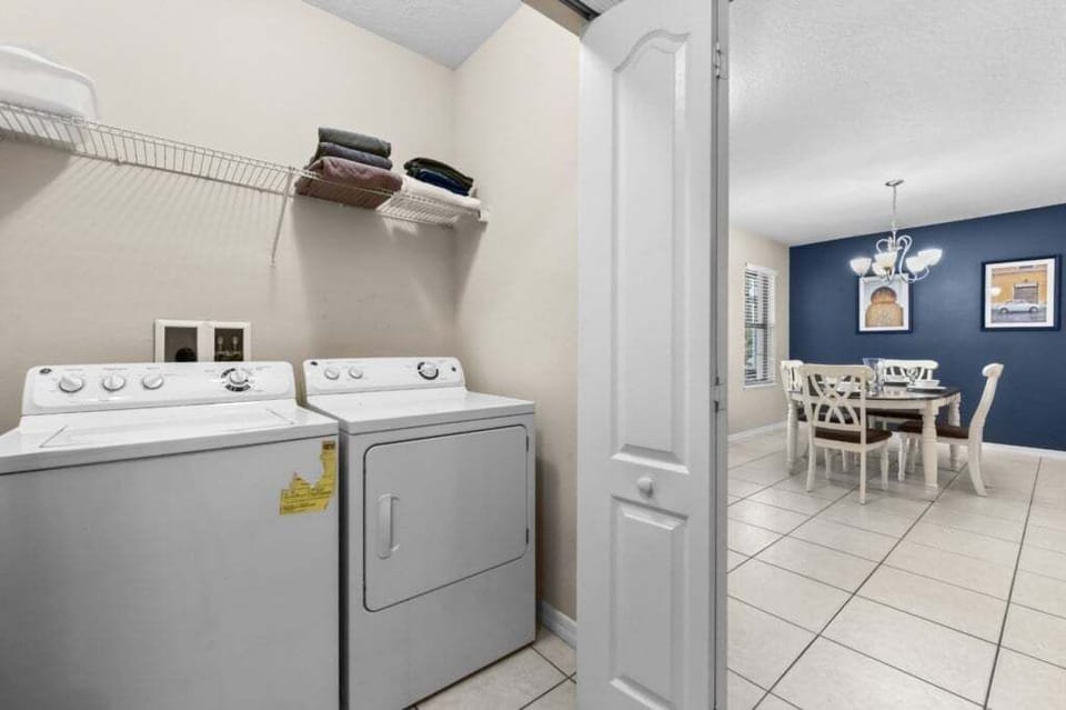 LAUNDRY CLOSET:  Full-Size Washer & Dryer.  Located Downstairs adjacent to Foyer and Game Room.