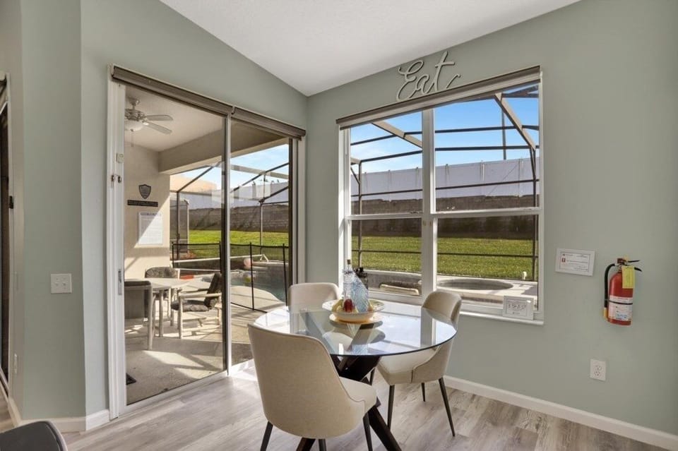 Cozy breakfast nook with a view of the pool, perfect for morning coffee.