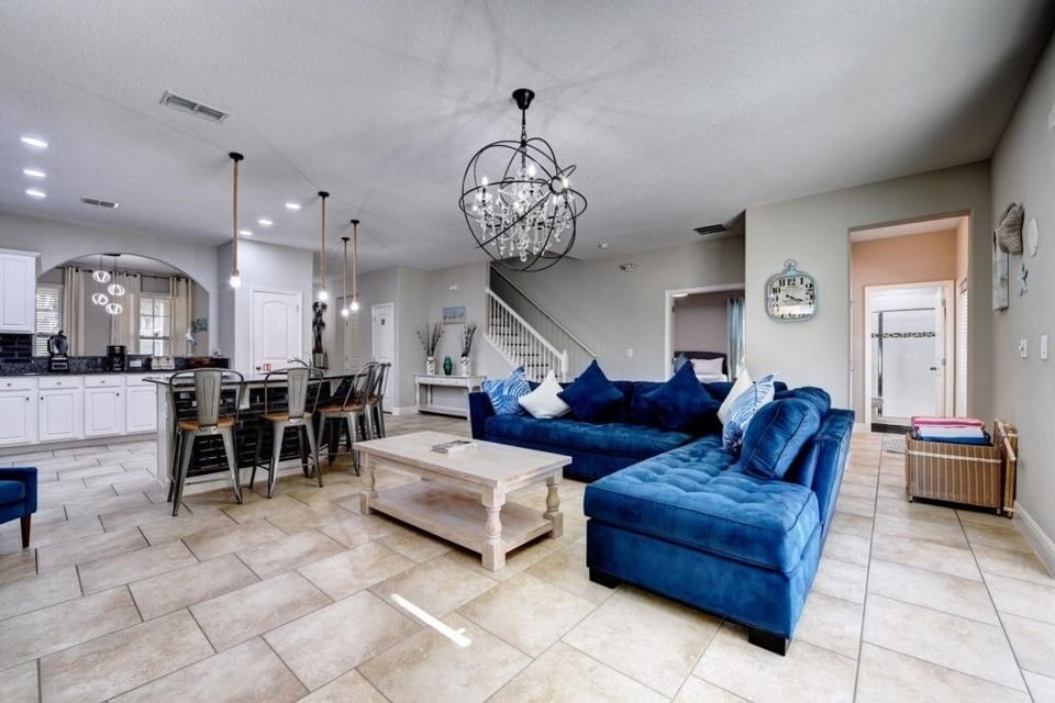 LEISURE ROOM:  Living Room Area with Sofa that seats between 4-5 people, 2 Accent Chairs and 65” Flat-Screen TV