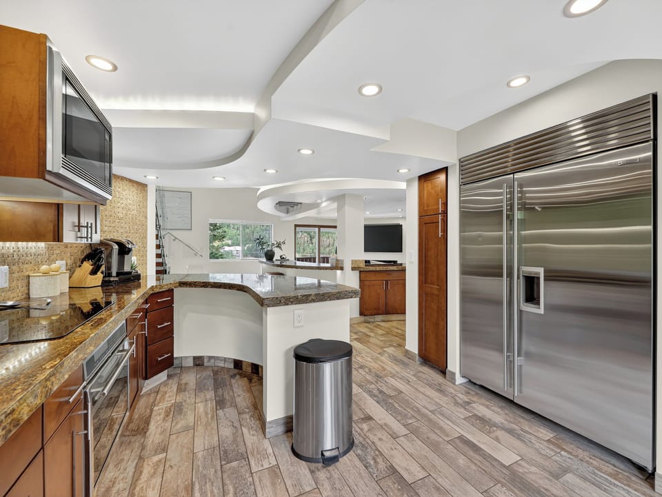 Upgraded ceiling lighting design as seen from the kitchen