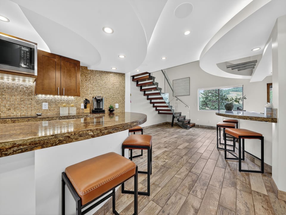 Upgraded ceiling lighting design as seen from the entryway.