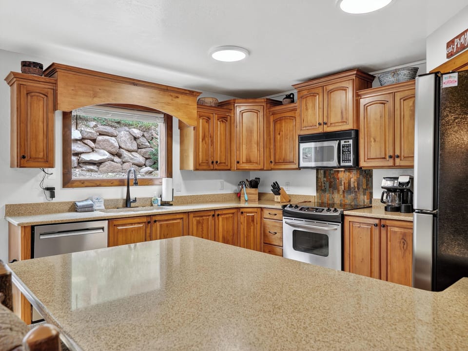 View of the fully stocked kitchen with everything you need for cooking and dining on the mountain
