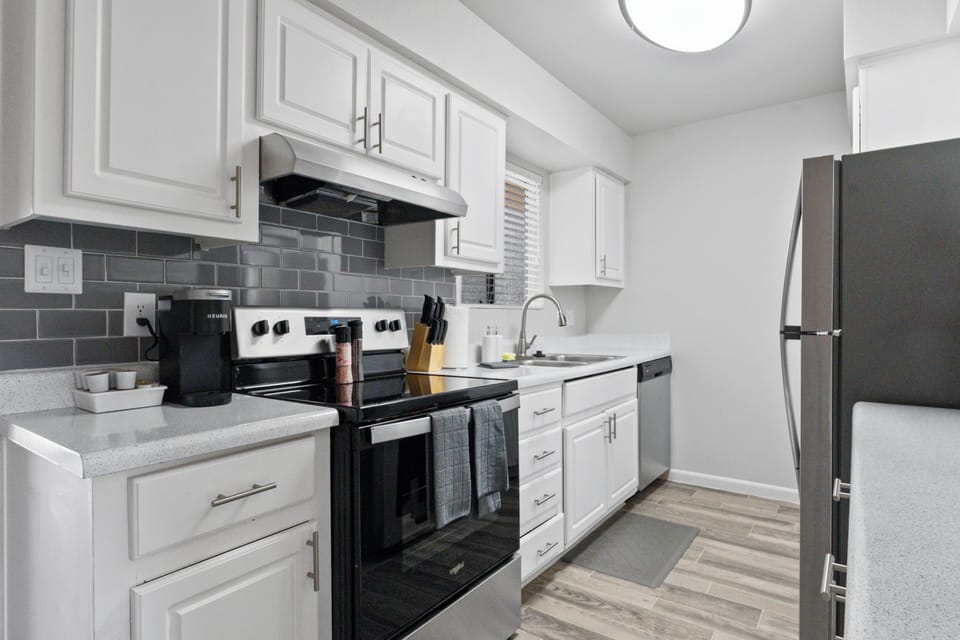  Modern fridge and ample counter space for easy meal prep.