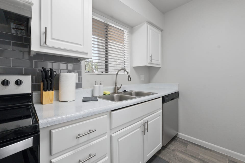  Modern fridge and ample counter space for easy meal prep.