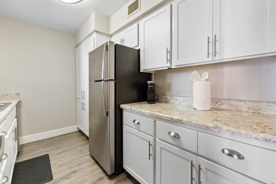  Modern fridge and ample counter space for easy meal prep.