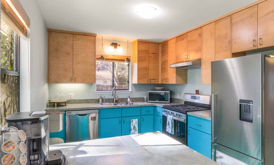 Full kitchen with refrigerator/freezer, gas stove, oven, microwave, dishwasher