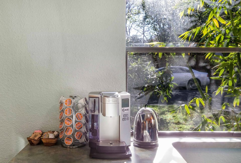 Coffeemaker, coffee, condiments, hot water kettle