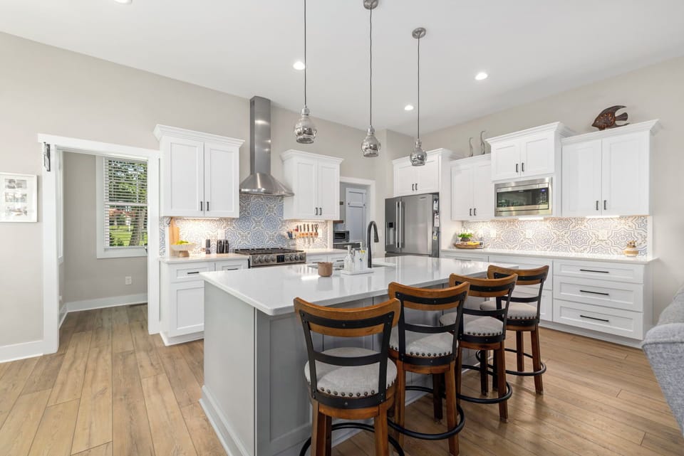 Fully equipped kitchen with bar seating.
