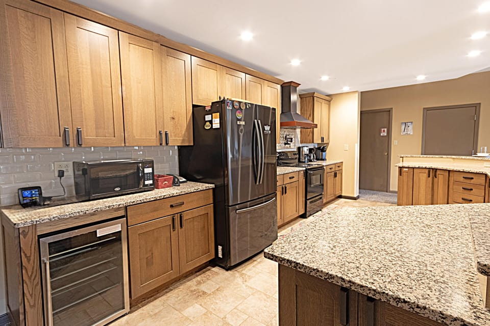 Kitchen has wine fridge.