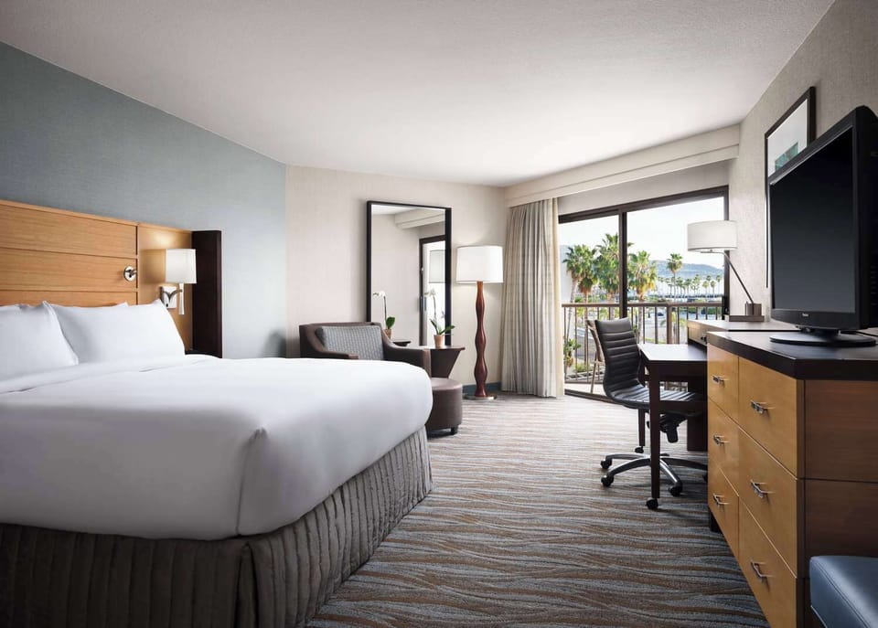 Wake up to palms outside your private balcony retreat.